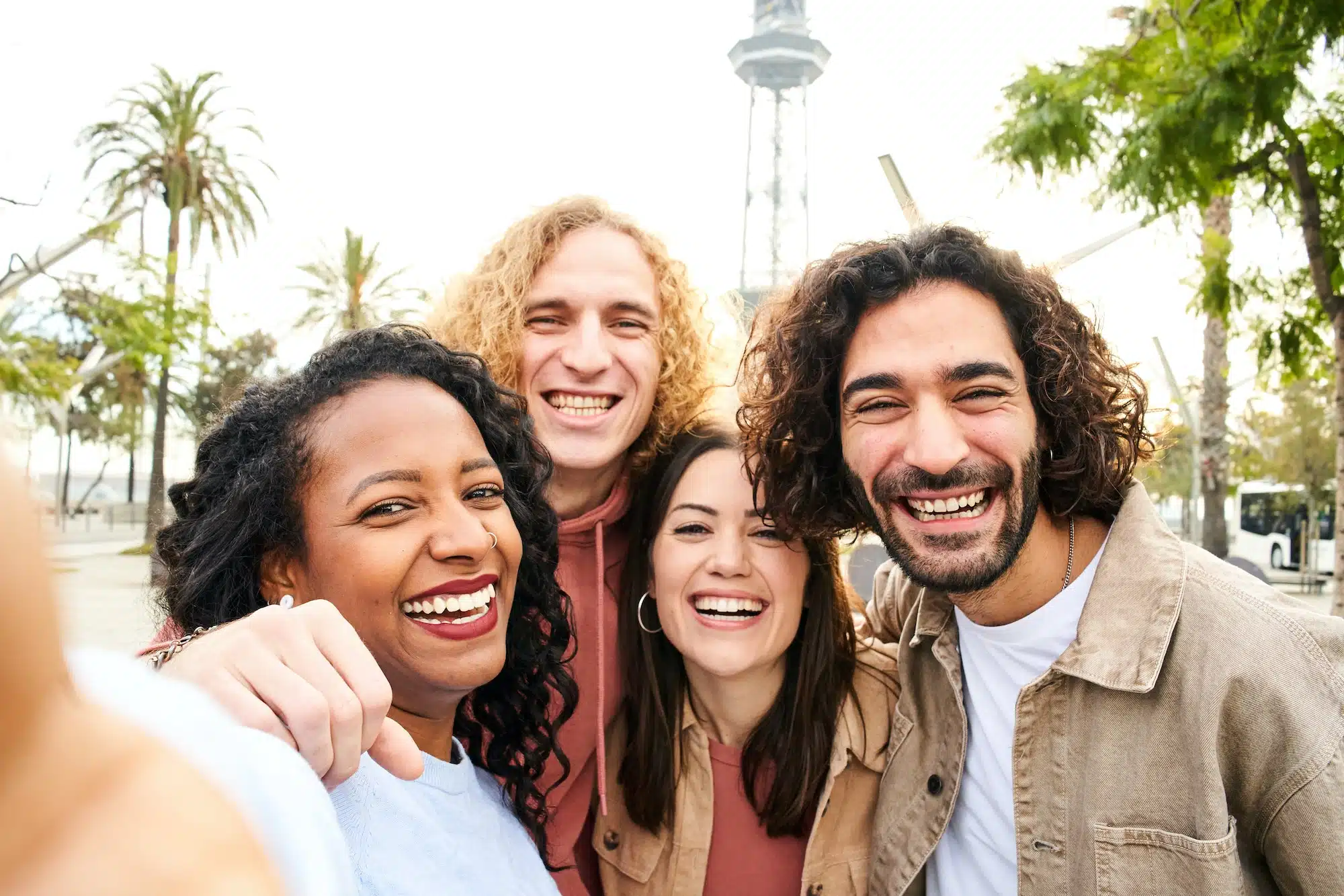 Selfie of Multi-ethnic group of smiling people looking at the camera. Cheerful photo